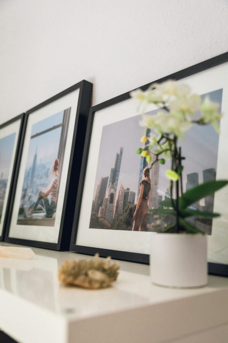 11x14 picture frame styling idea: a black framed print beside a vase of white flowers