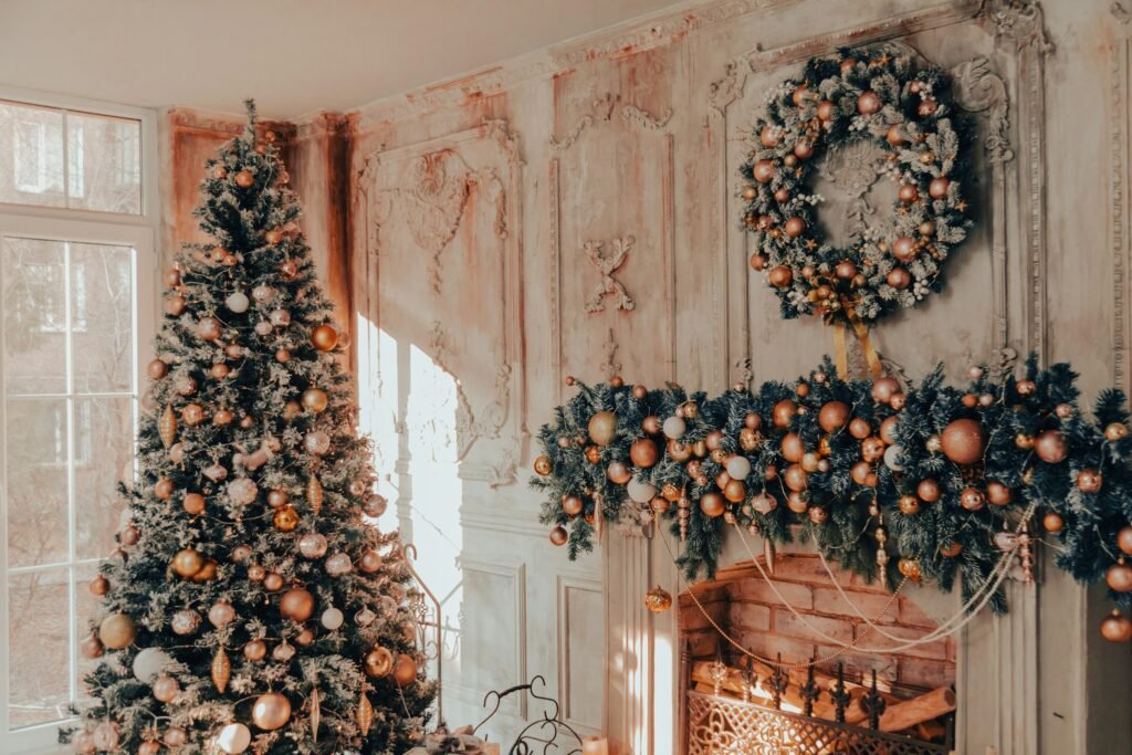 Best artificial Christmas tree decorated with gold ornaments beside a matching mantel garland and wreath