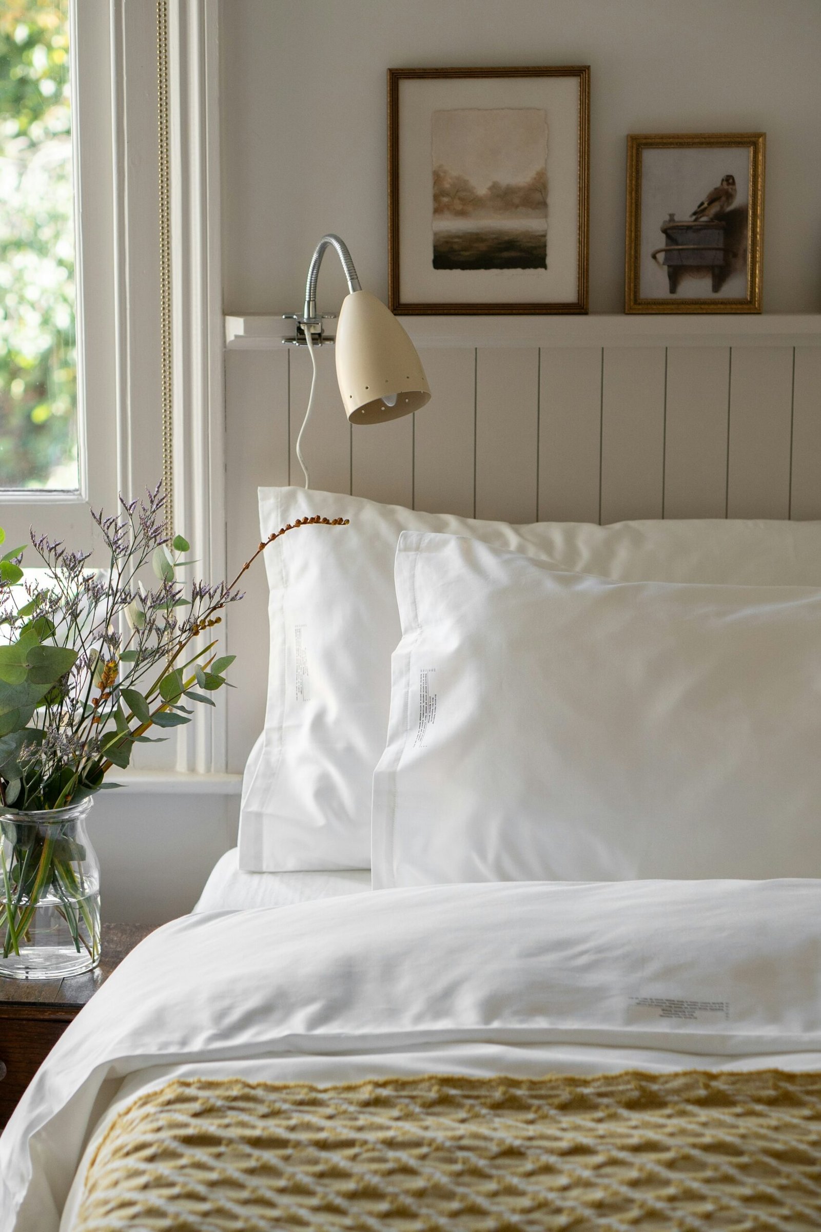 Best comforters on a neatly made bed in a bright bedroom