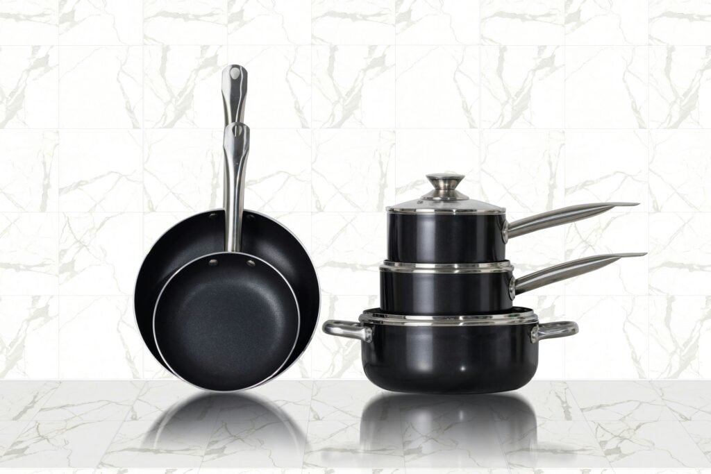 Best nonstick cookware set with frying pans, saucepans and a casserole with lid on a marble counter