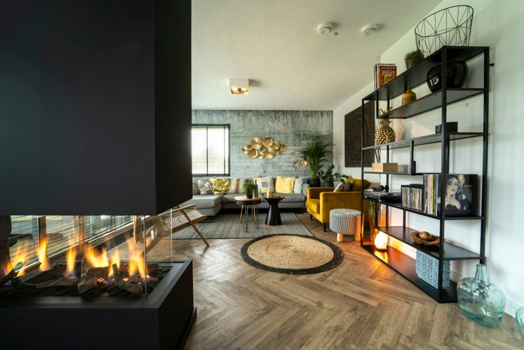 Wide linear fireplace with a glass front in a modern living room, the look a wall mounted electric fireplace recreates