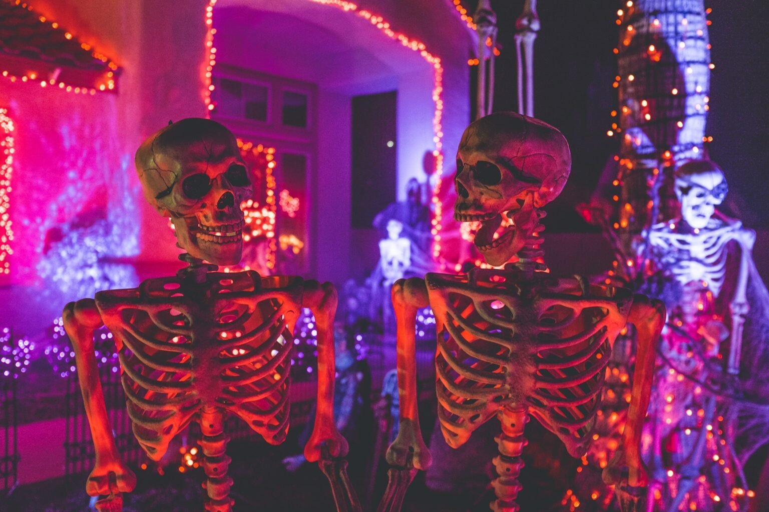Best Halloween decorations: skeletons and string lights outside a house
