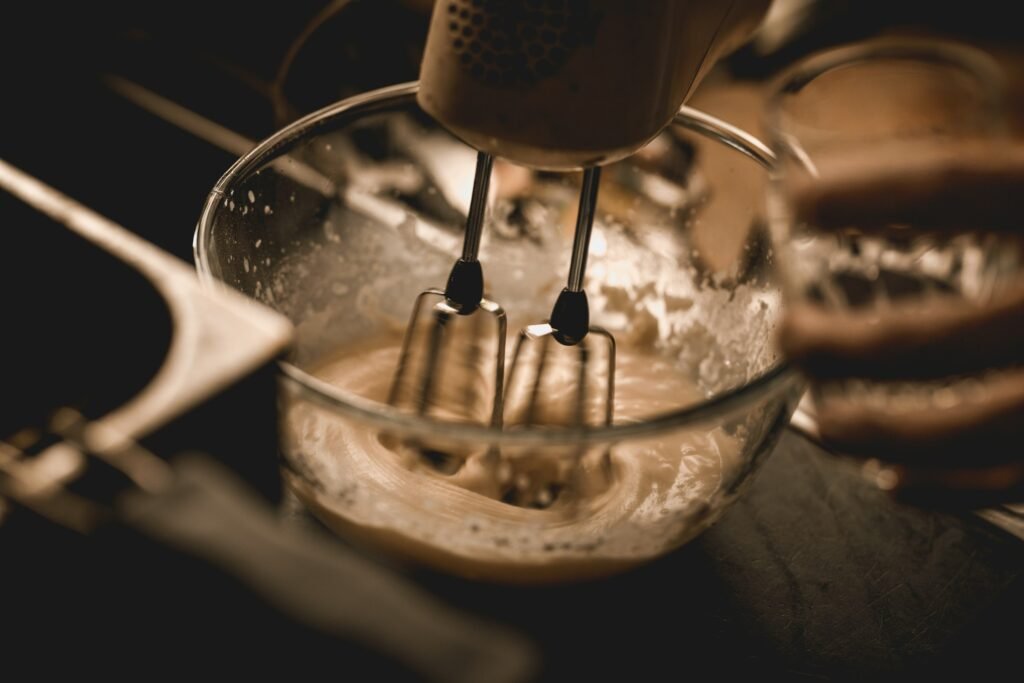 Best hand mixer for cookie dough beating batter in a glass mixing bowl