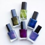 Luxury nail polish gift set: six glossy nail polish bottles in jewel-tone shades