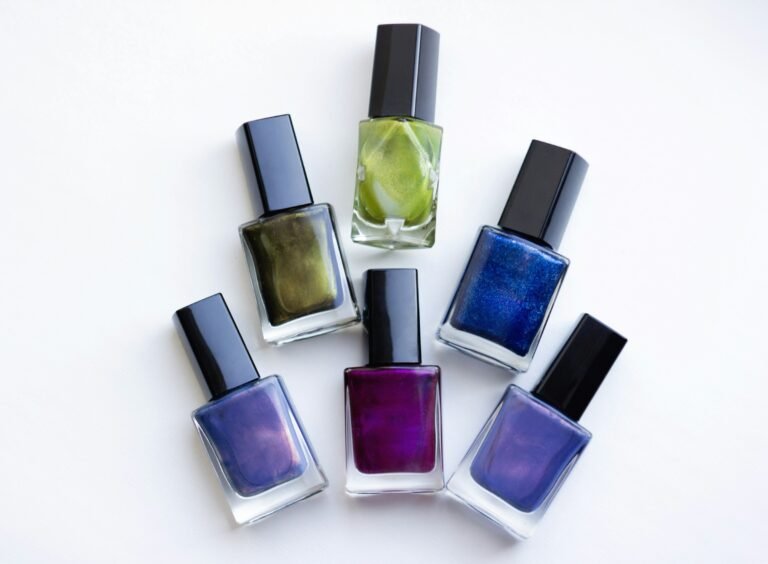 Luxury nail polish gift set: six glossy nail polish bottles in jewel-tone shades