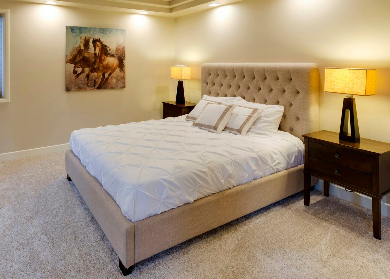 Best mattress in a box under 500 set up on an upholstered bed frame in a bright bedroom