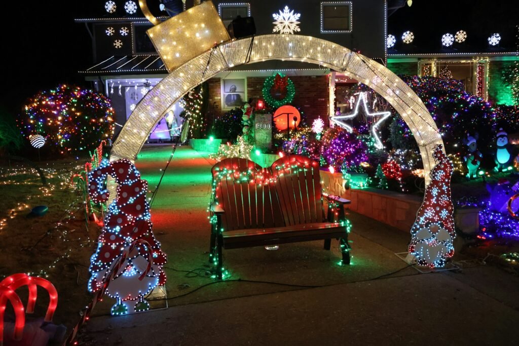 Yard Christmas light display with several cords run to one outdoor outlet, the setup a smart plug for Christmas lights or a timer controls