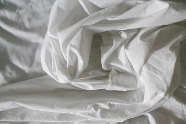 Best queen sheet sets on a neatly made bed with white pillows