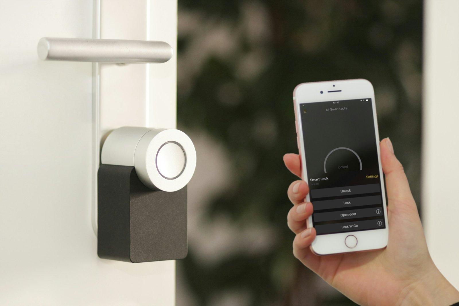 Best smart lock retrofit on a white front door, unlocked from a phone app
