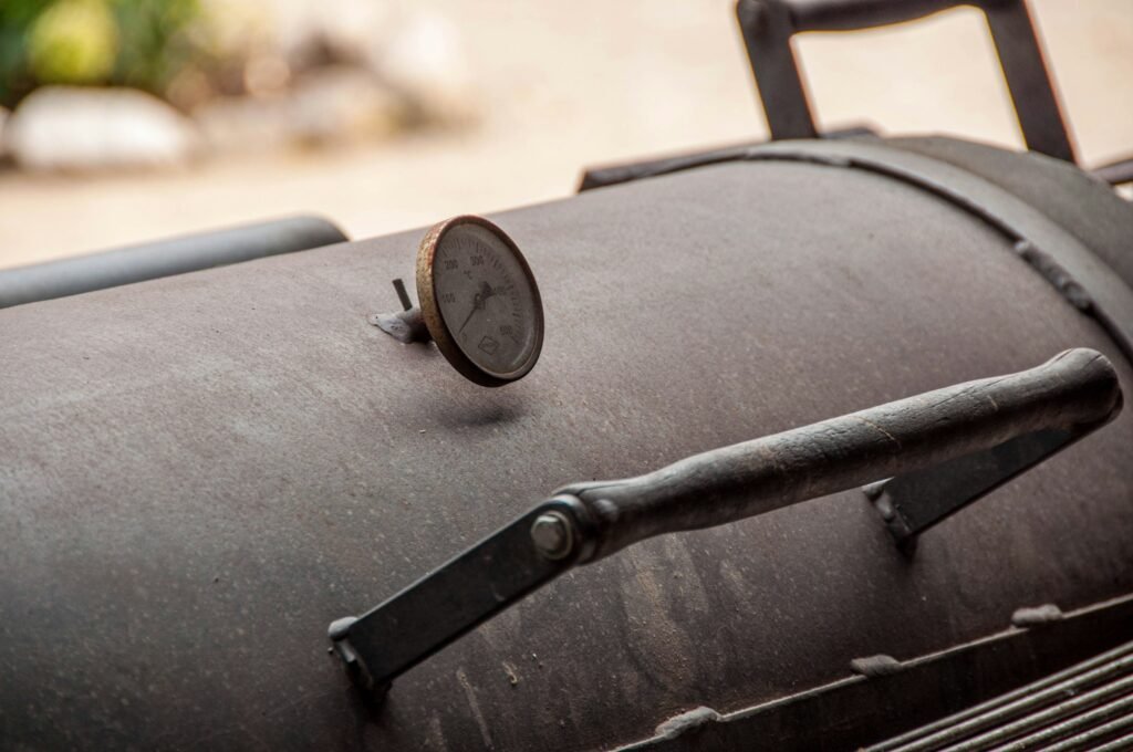Lid dial on an offset smoker, which reads air temperature only, a reason to use the best wireless meat thermometer for smoker cooks