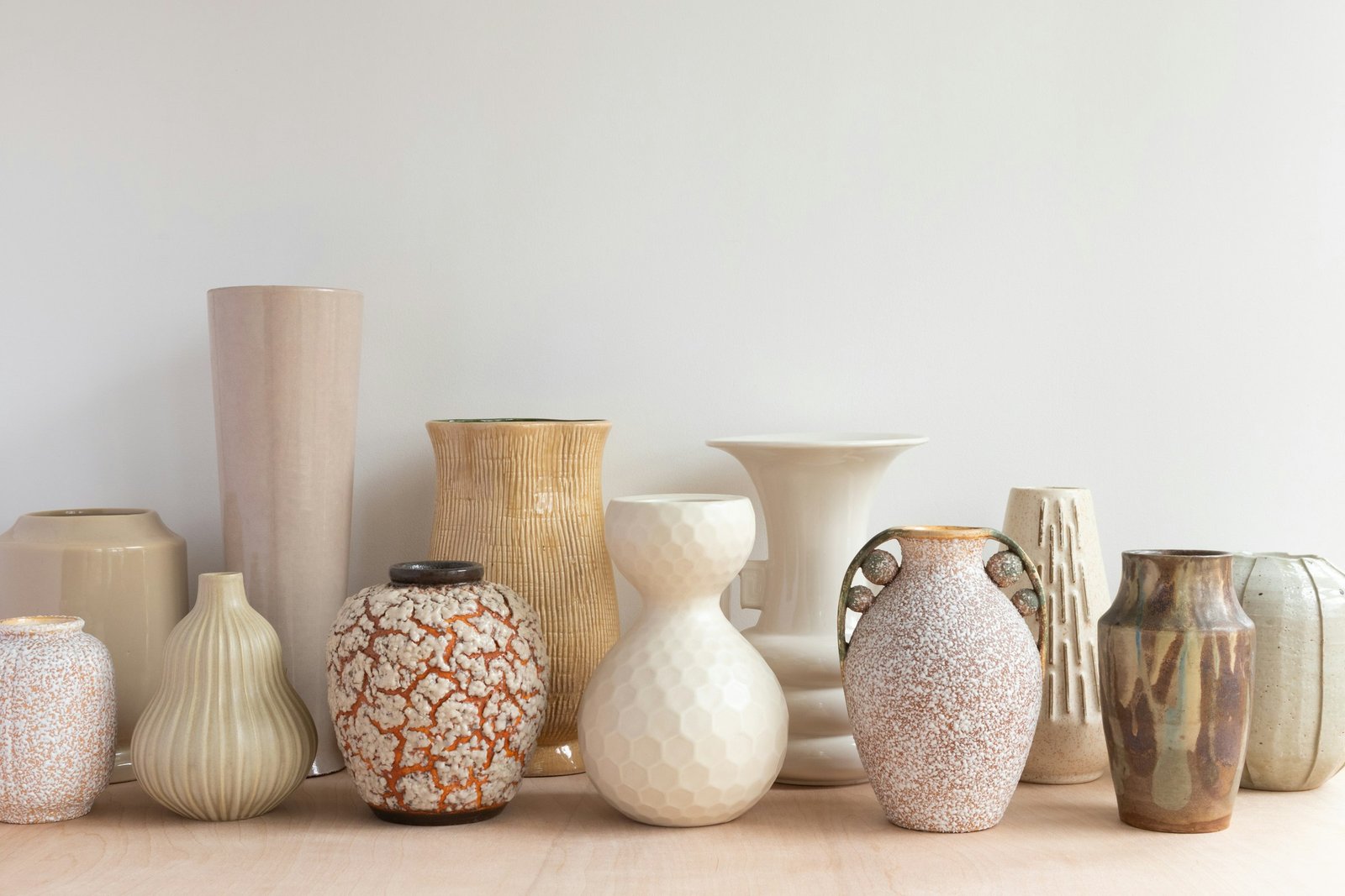 Ceramic vase set style: neutral-toned ceramic vases grouped on a shelf