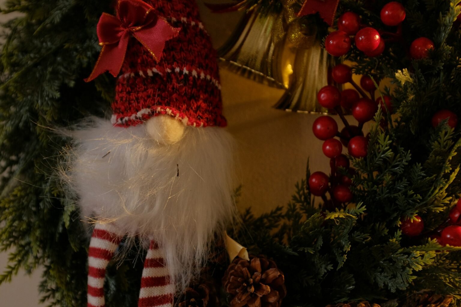 Christmas gnome topiary styling idea: a gnome decoration with berries and pinecones