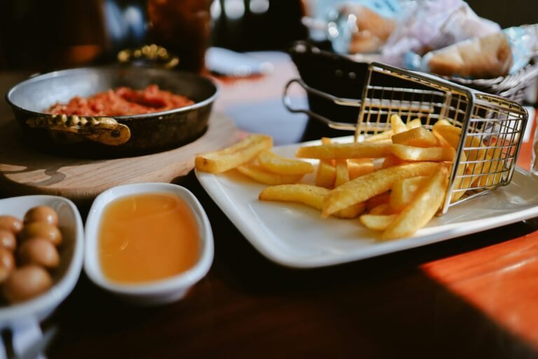 Crispy fries in a wire basket, a reminder of how to clean an air fryer basket after cooking