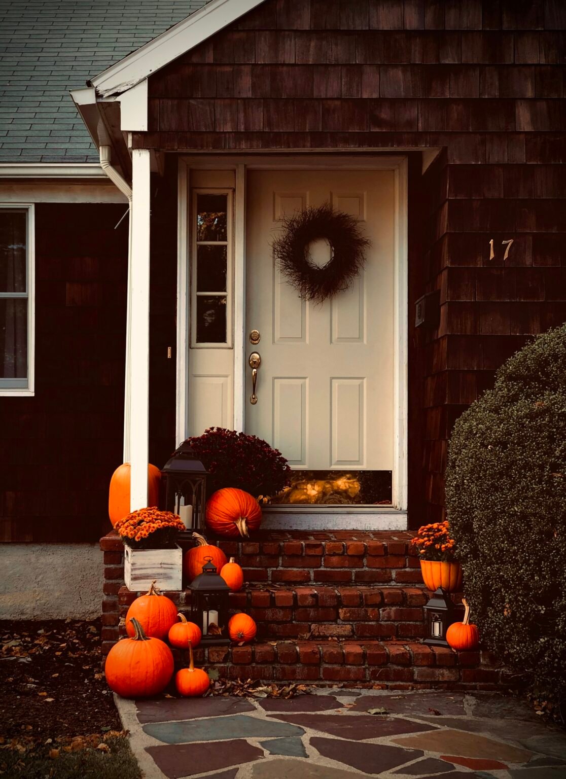 Pumpkins arranged on indoor stairs