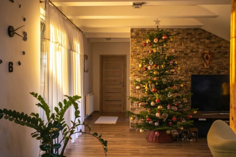 Dunhill fir Christmas tree look: full 7.5 ft artificial fir with gold and red ornaments in a bright living room