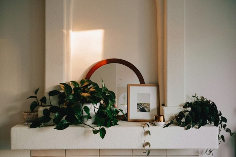 Easter mantel decor with a mirror and plants on a white mantel