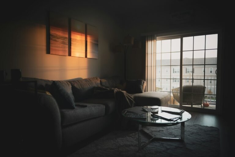 Essential oil diffuser setting: sectional sofa near a coffee table and window