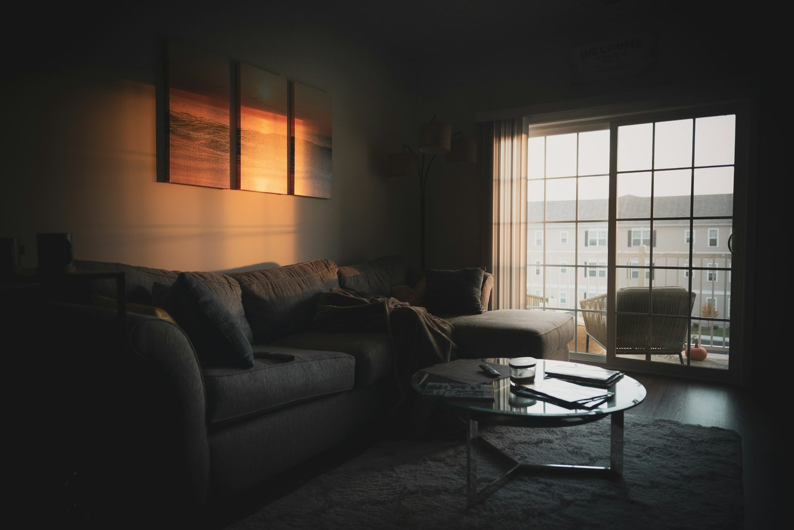 Essential oil diffuser setting: sectional sofa near a coffee table and window
