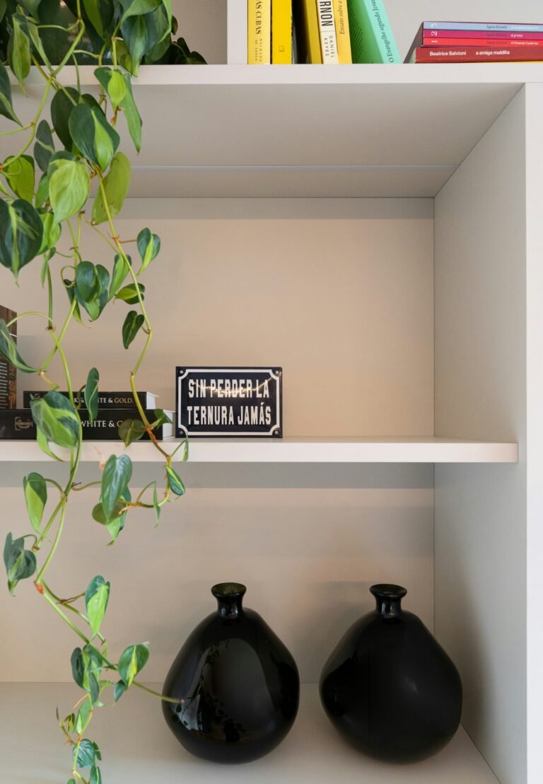 Trailing greenery over white shelves, styled like a fake hanging plant