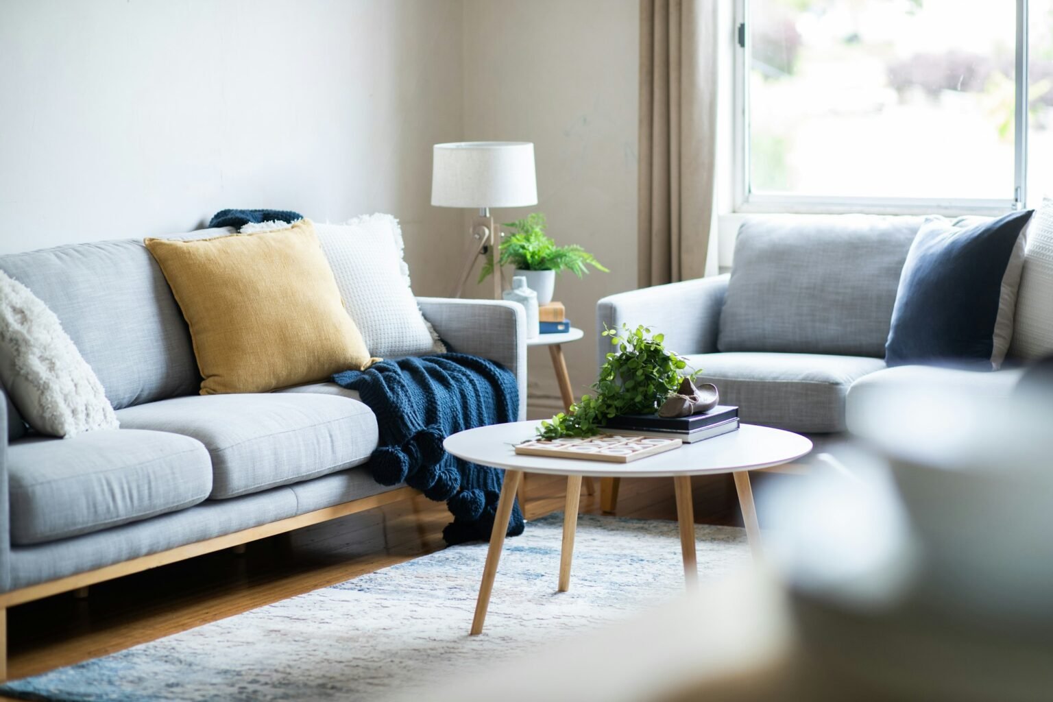 Cozy living room with a couch where folding snack tables fit next to the seats