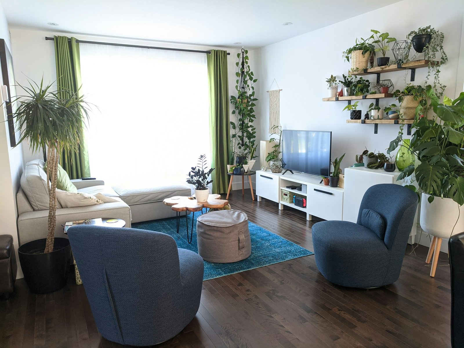 Grow light plant stand idea: potted plant beside a gray armchair