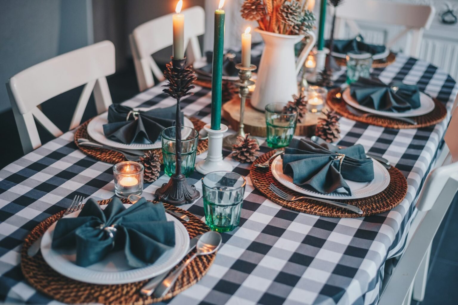 Candles and pumpkins on a fall dinner table