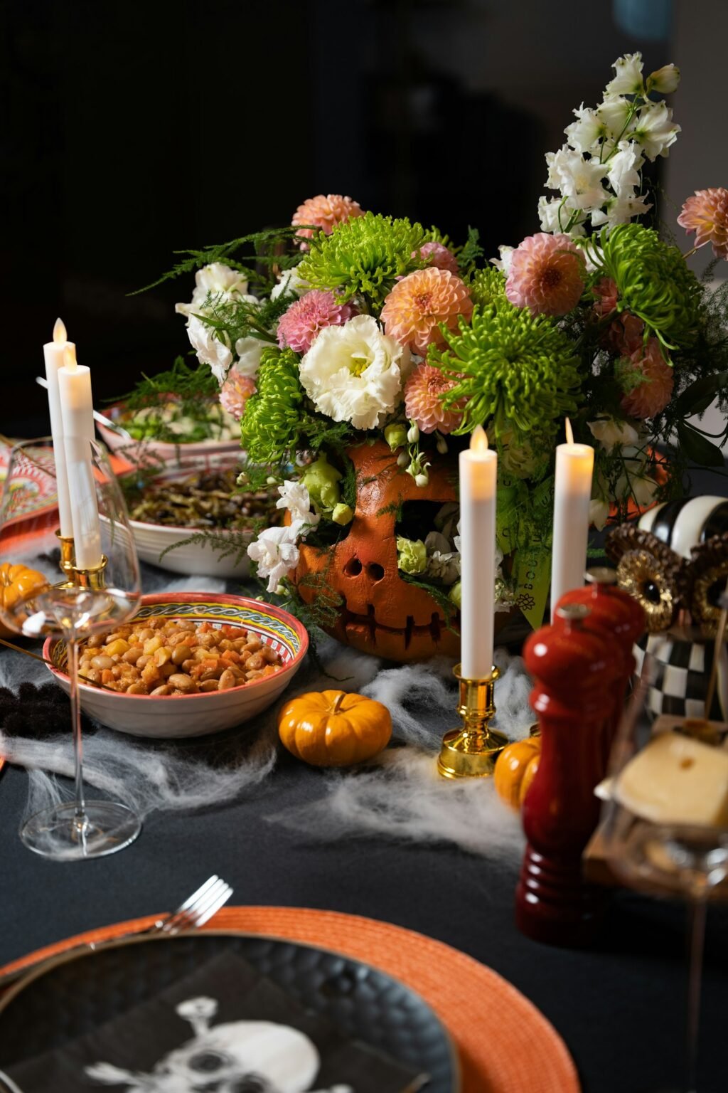 A dinner table with food and flowers