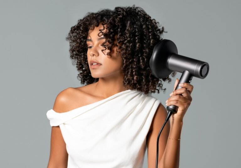 How to use leave in conditioner and deep conditioner: woman diffusing curly hair after her wash-day routine