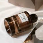 LOVERY perfume review: a brown glass eau de parfum bottle resting on white satin