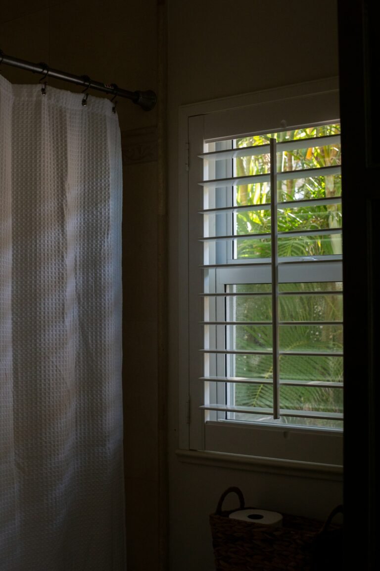 Waffle shower curtain styling idea: a fabric curtain beside a bathroom window