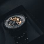 OLEVS automatic watch review: a skeleton automatic watch with Roman numerals resting in a gift box