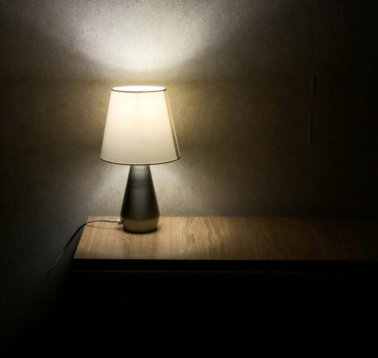 Rechargeable table lamp idea: a white lamp on a wooden table