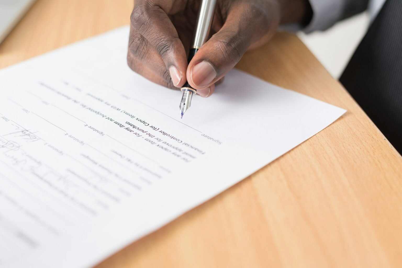 How to break a lease – Person writing on white paper