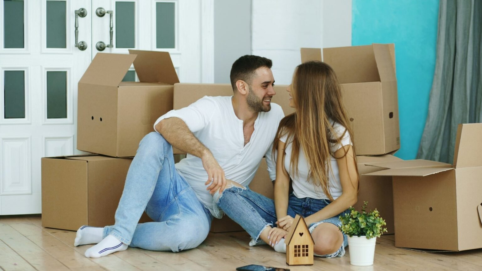 Couple surrounded by moving boxes