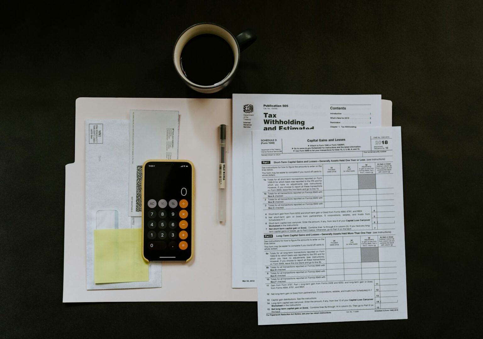 Smartphone near a pen and papers