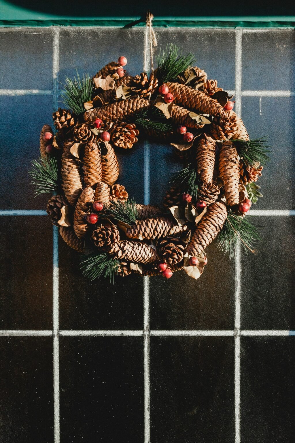 Christmas decorating ideas – Green Christmas wreath hanging on a door