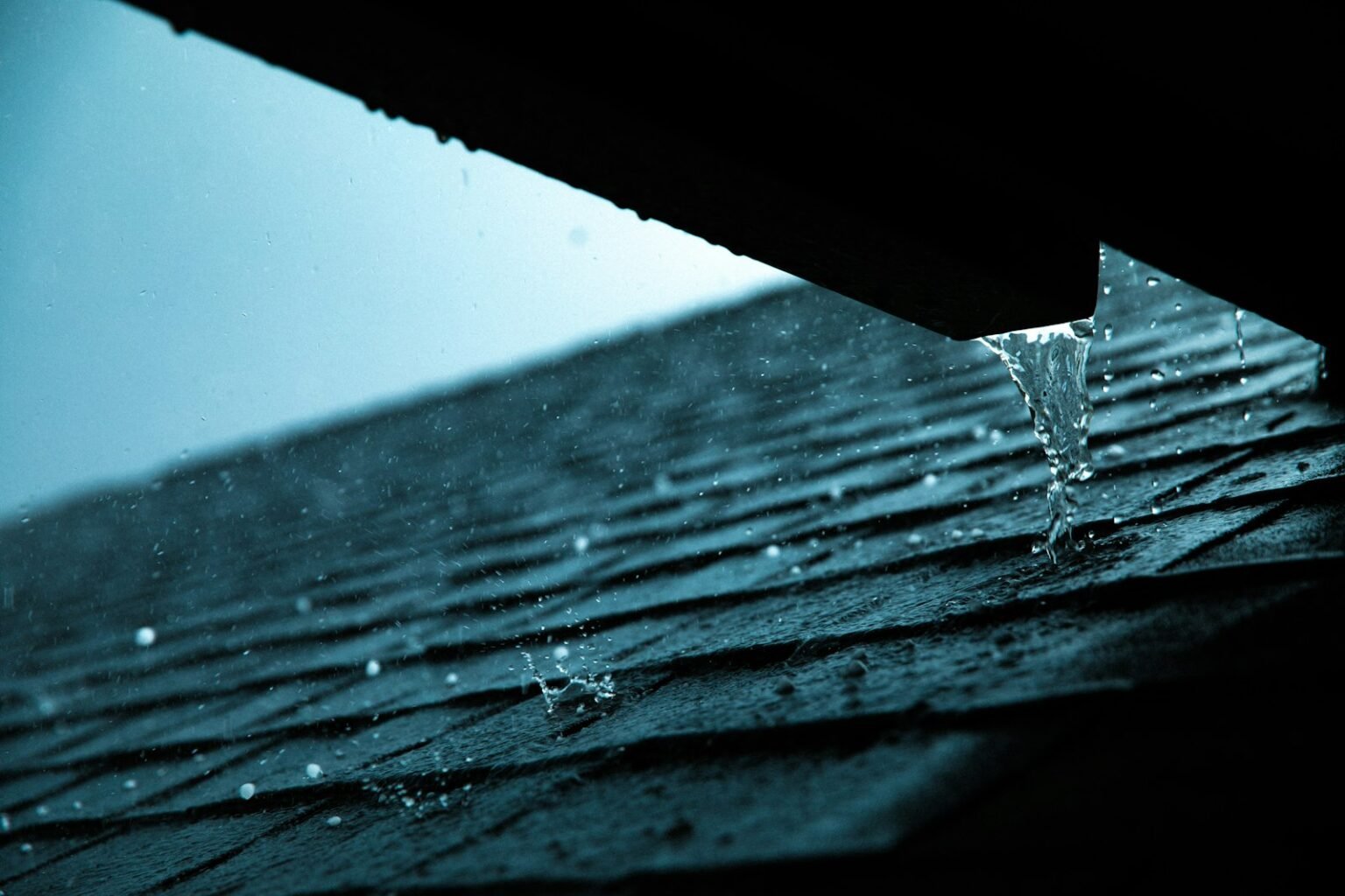 Gutter replacement cost – Rain gutter on a roof edge
