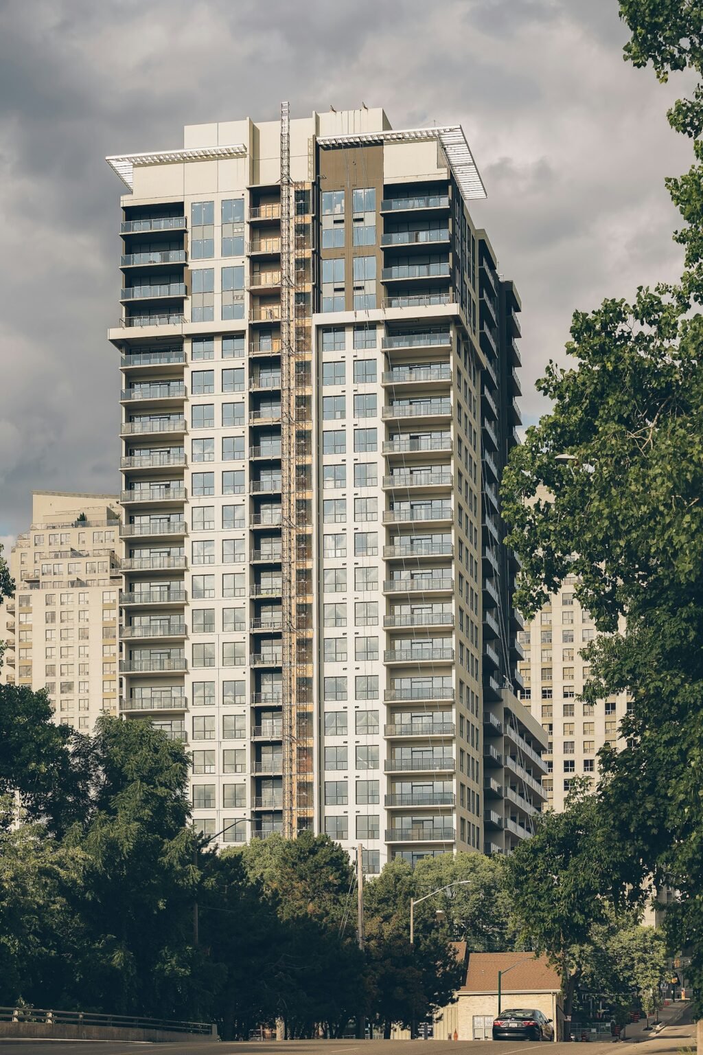 Apartment building near green trees
