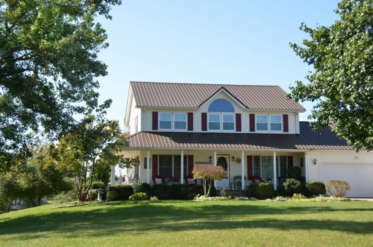 White two-story house with a front porch