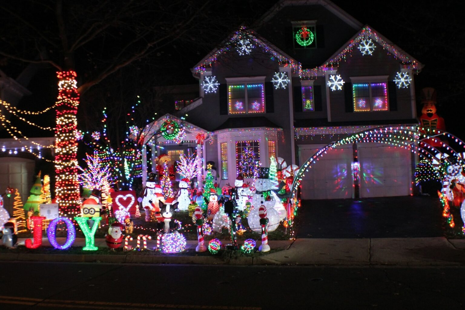 House and yard covered in Christmas lights