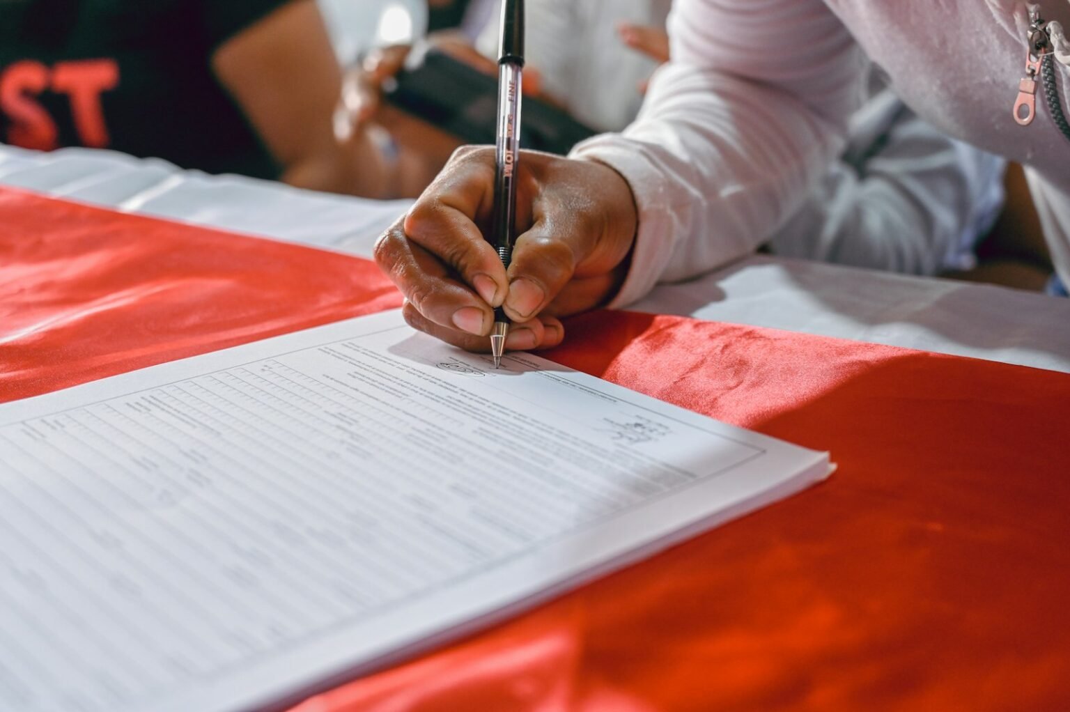 Person writing on paper