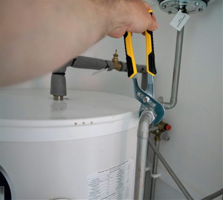 Plumber working on a water heater