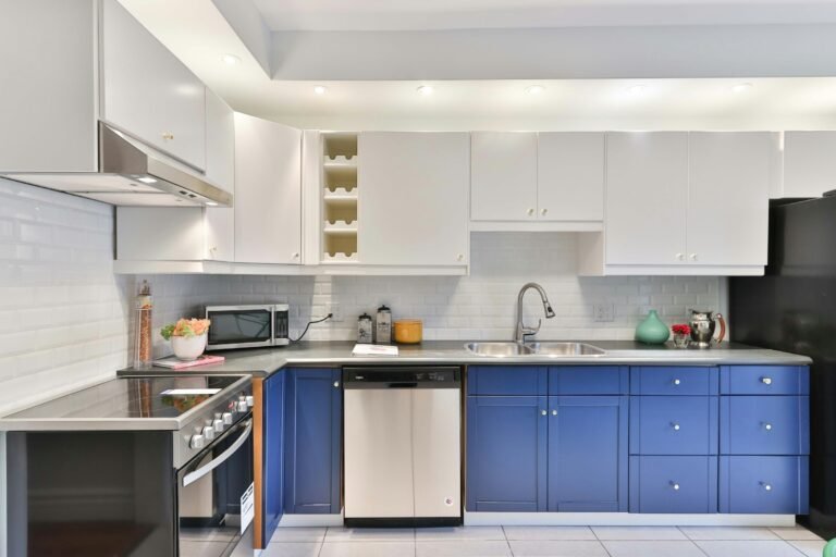 Kitchen with navy blue cabinets
