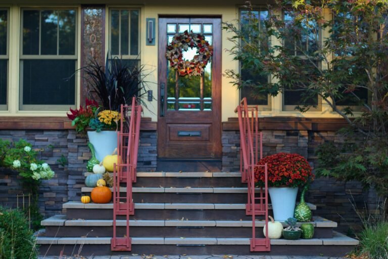 Front porch steps decorated for fall