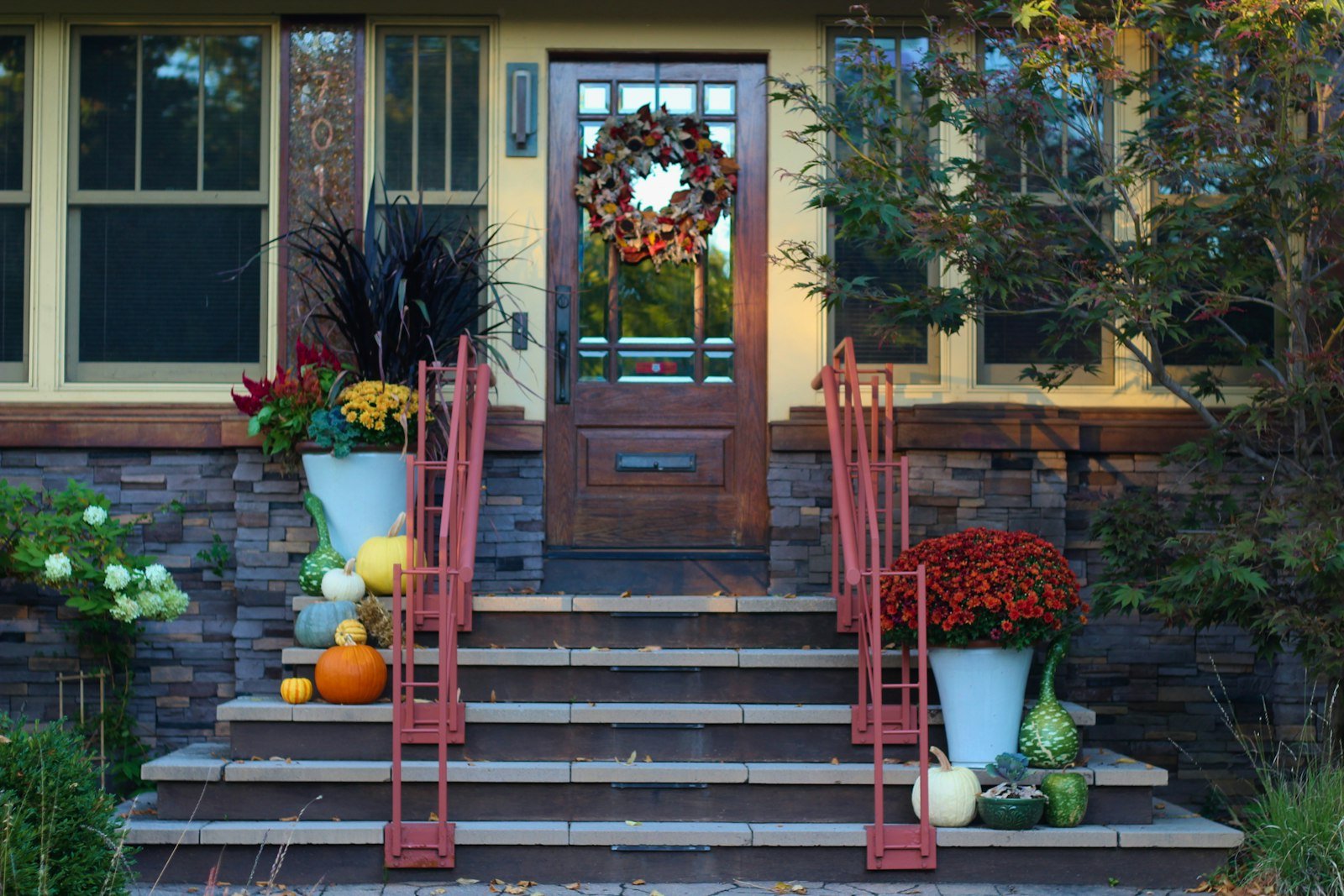 Front porch steps decorated for fall