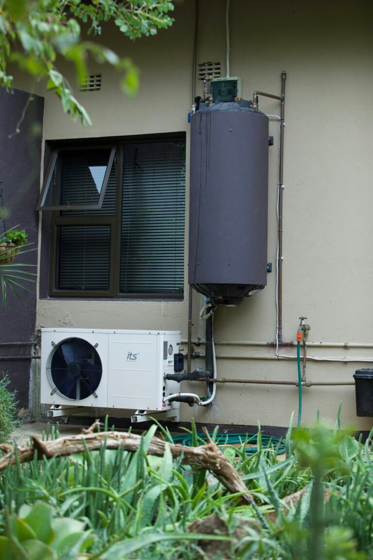 Water heater tank with pipes