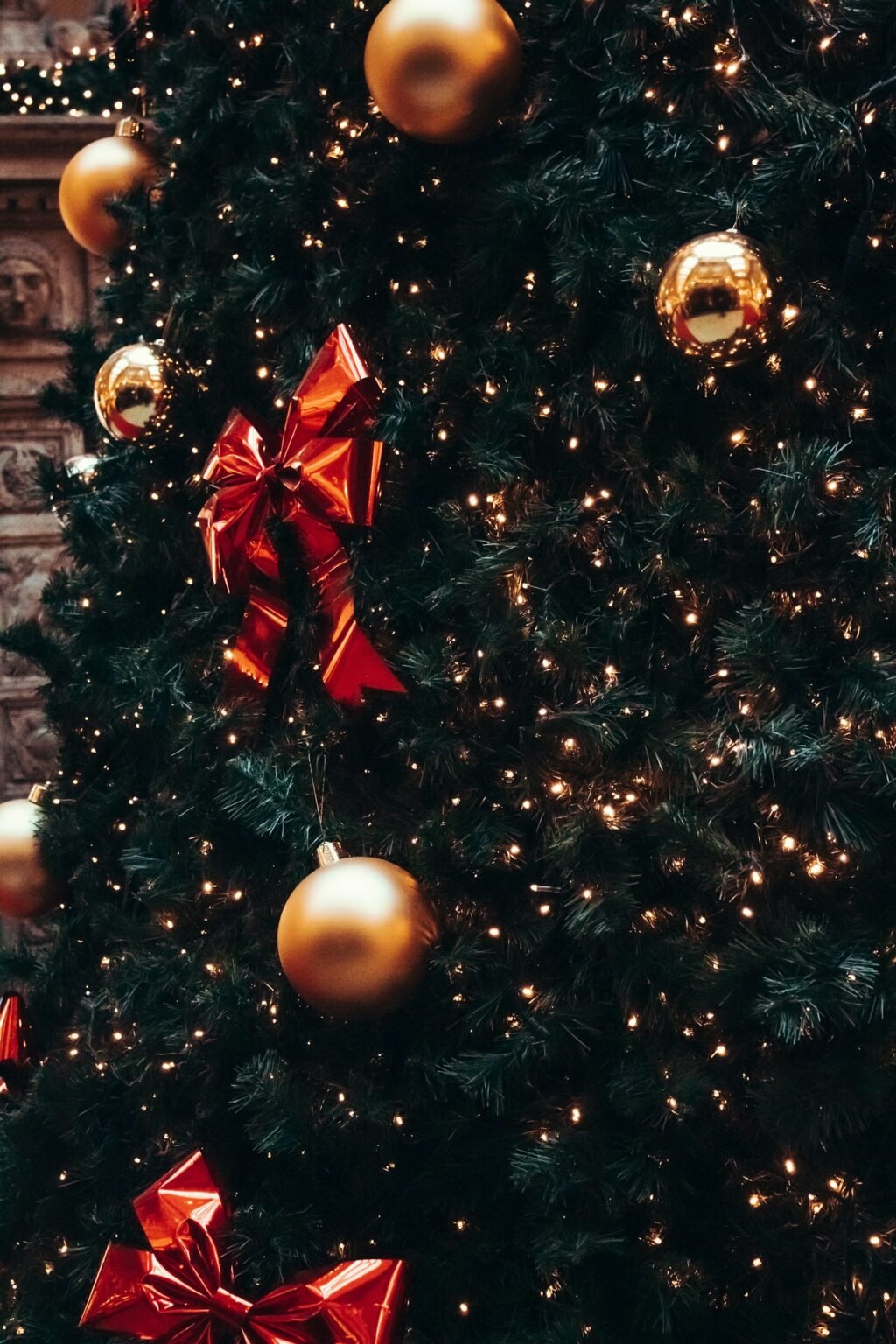 Gold and red ornaments on a Christmas tree