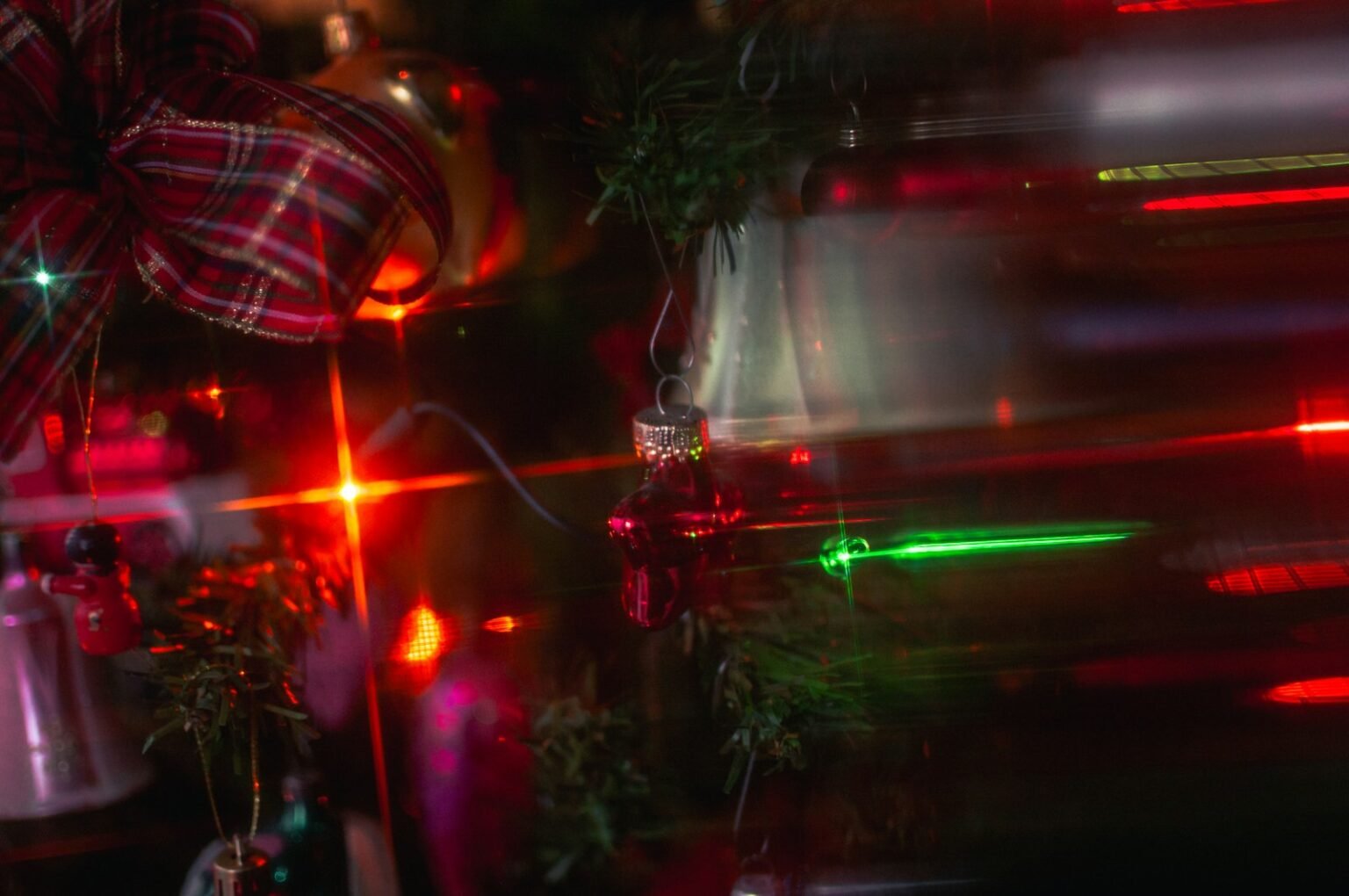 Plaid bow on a Christmas tree with lights