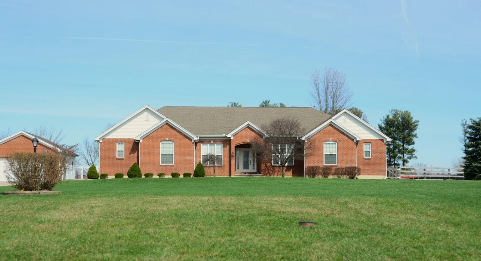 Large brick house with a lawn