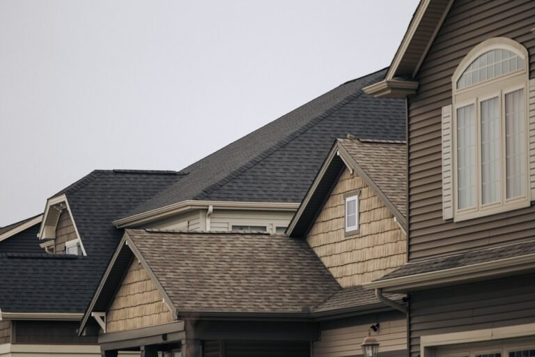 Houses with brown asphalt shingle roofs